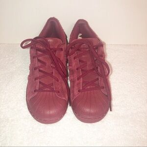 Adidas superstar suede burgundy shell toe sneaker.
